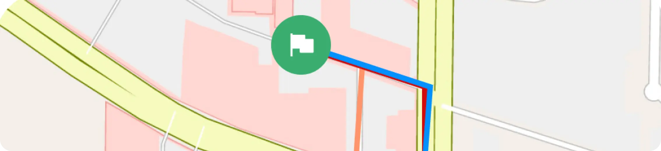 A digital map interface displaying a specific route highlighted in blue and red lines leading to a green flag icon, indicating the destination.