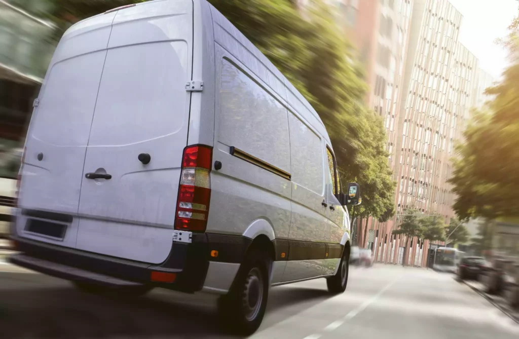 Delivery van in busy city traffic showing scalability and peak season logistical challenges for delivery teams