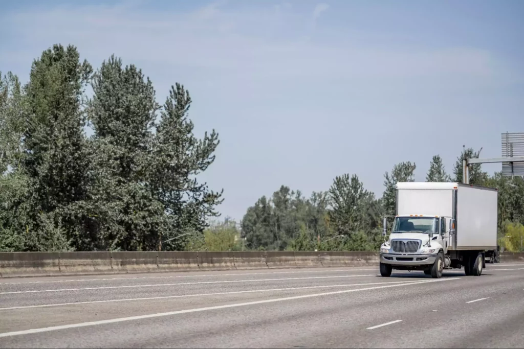 Freight truck traveling on highway illustrating real-time route optimization
