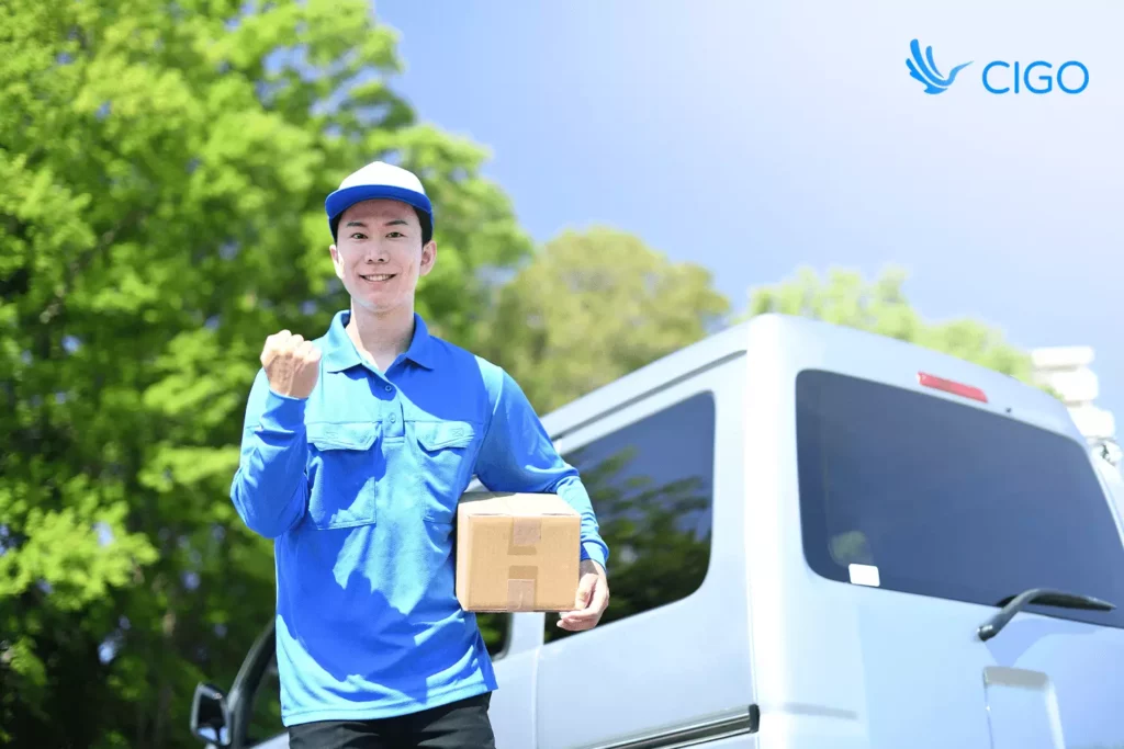 Courier holding a parcel by a van, celebrating successful logistics integration across platforms