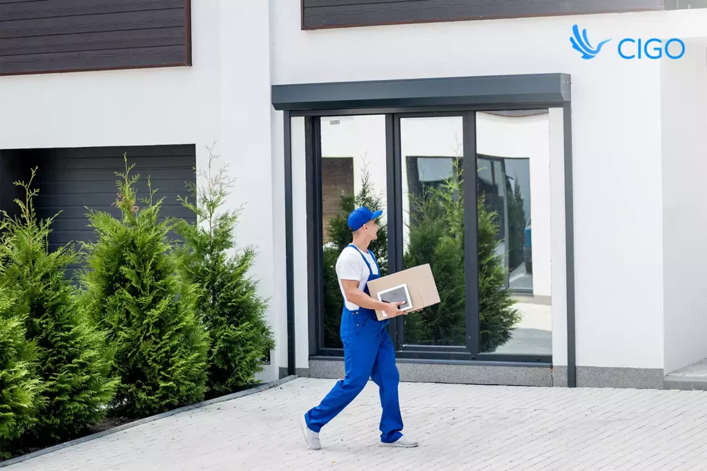 Driver walking a package to a door as an example of targeted workflow automation without system replacements