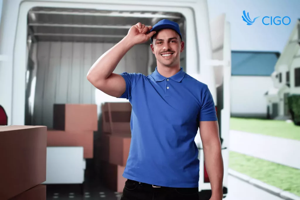 delivery driver standing in front of a loaded van