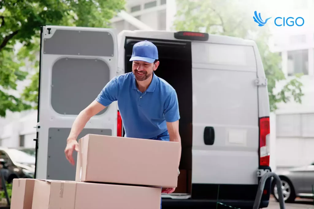 Courier loading packages into the delivery van