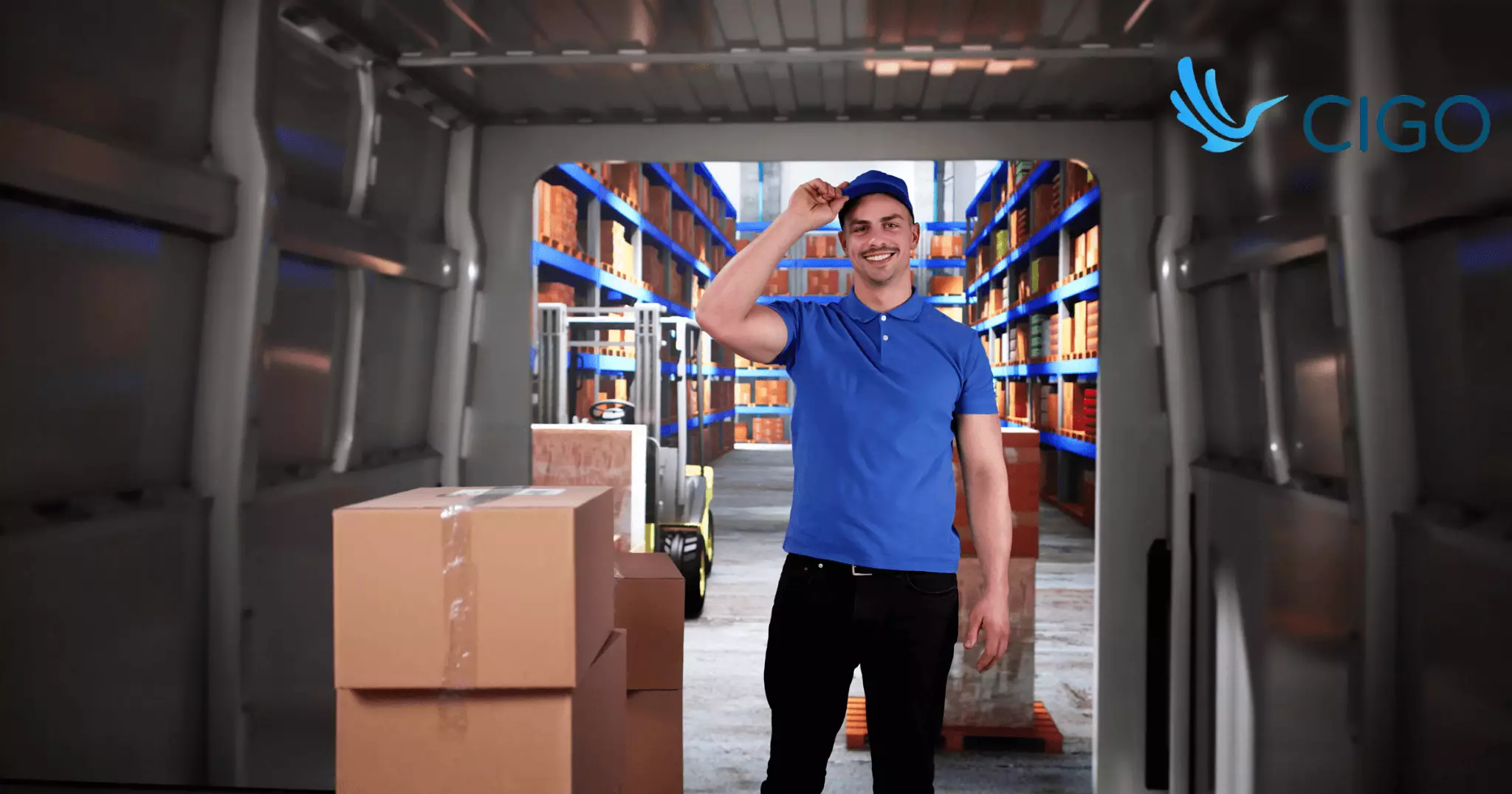 Delivery driver standing at open van doors with warehouse and packages in background