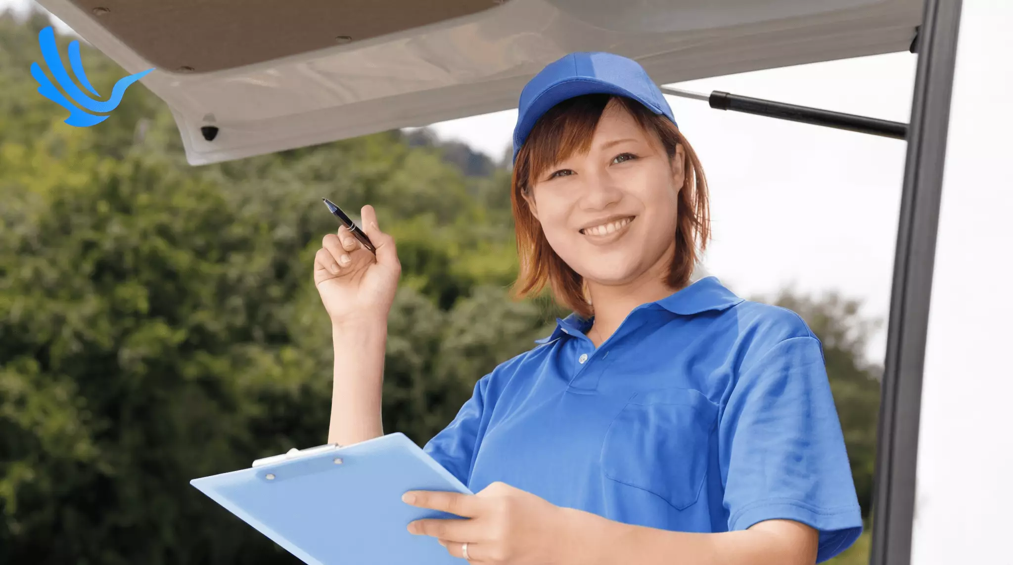 Female fleet driver reviewing capacity plan with clipboard at van