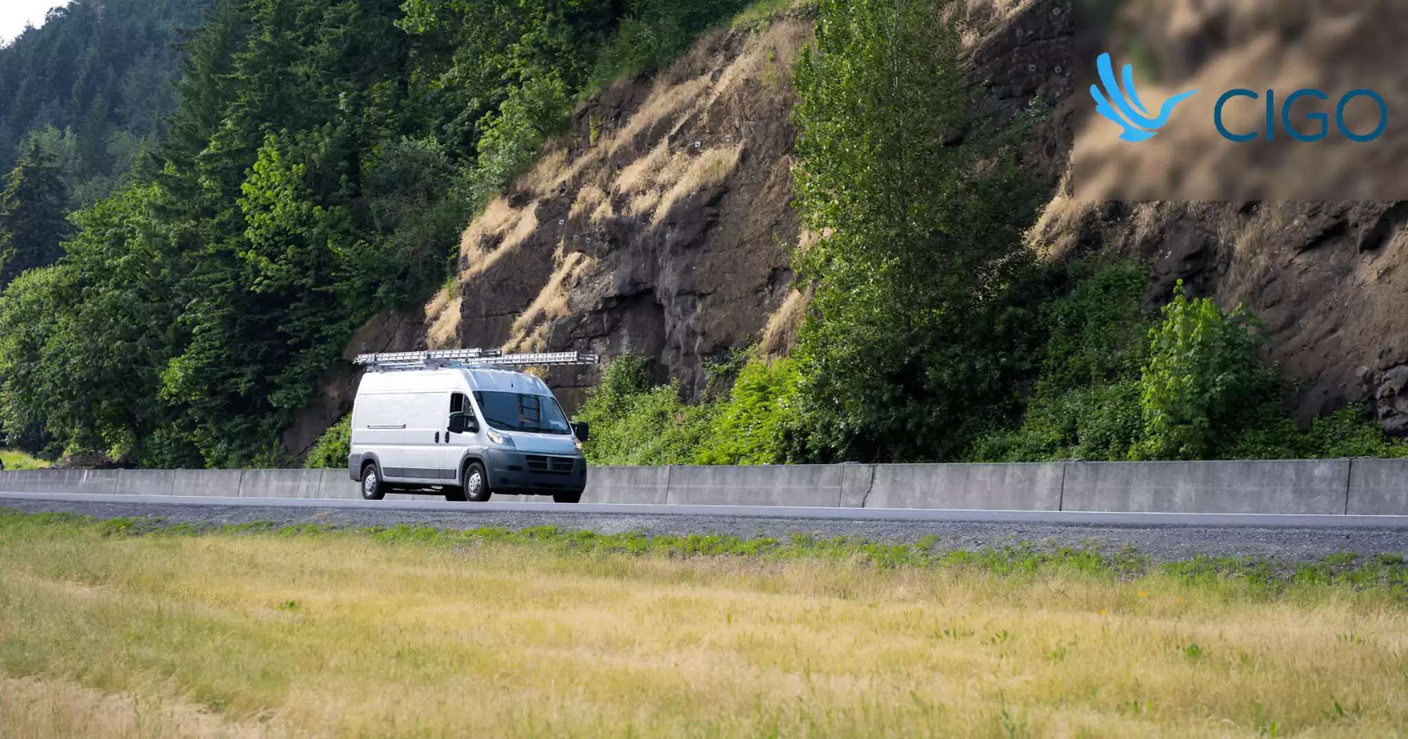 White delivery van on rural highway representing sparse low-density route
