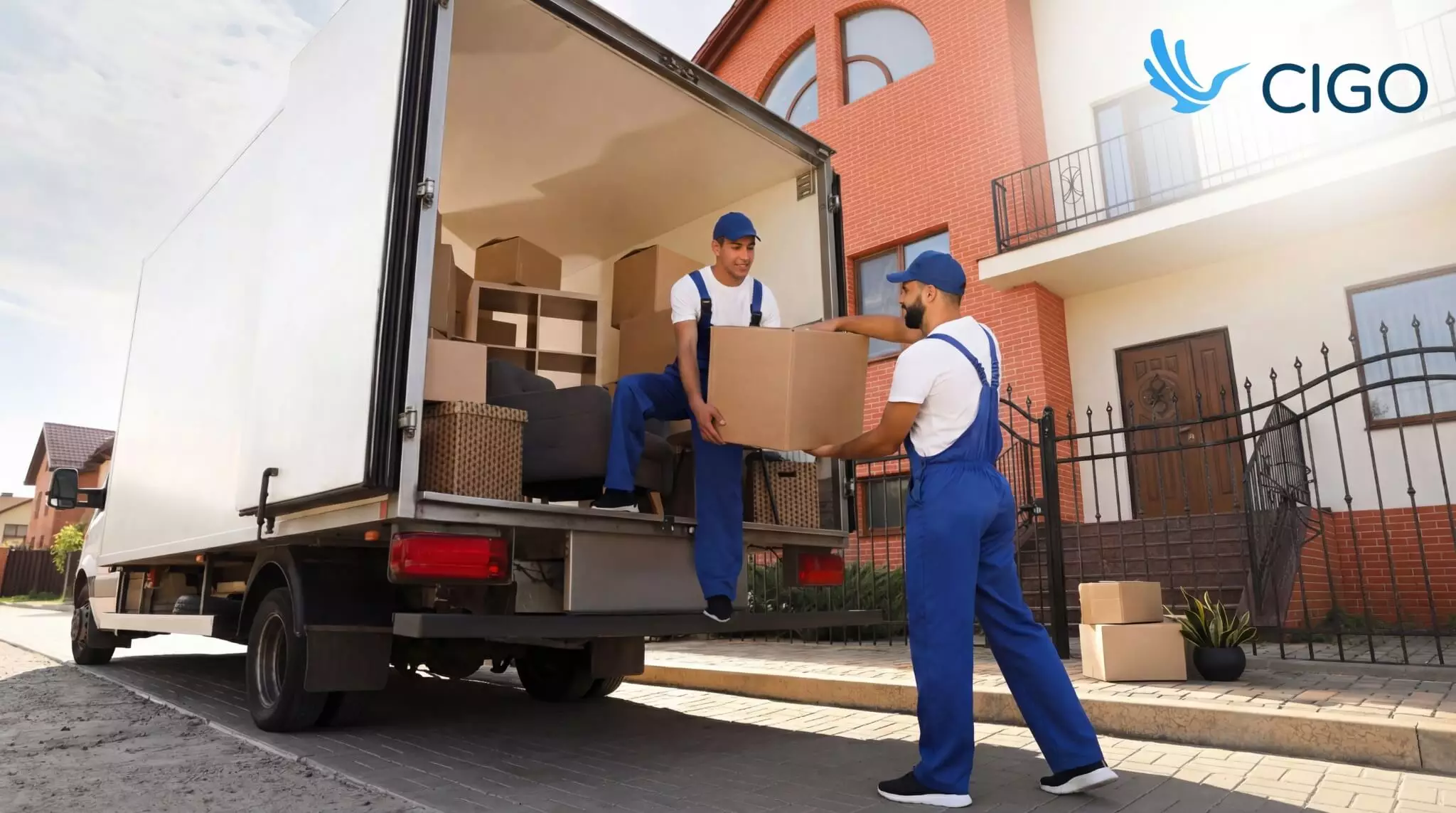 Moving crew unloading boxes from a truck