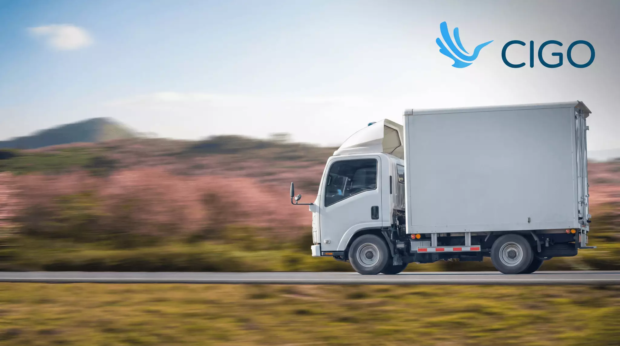 Box truck in motion showing active fleet delivery and real-time tracking visibility