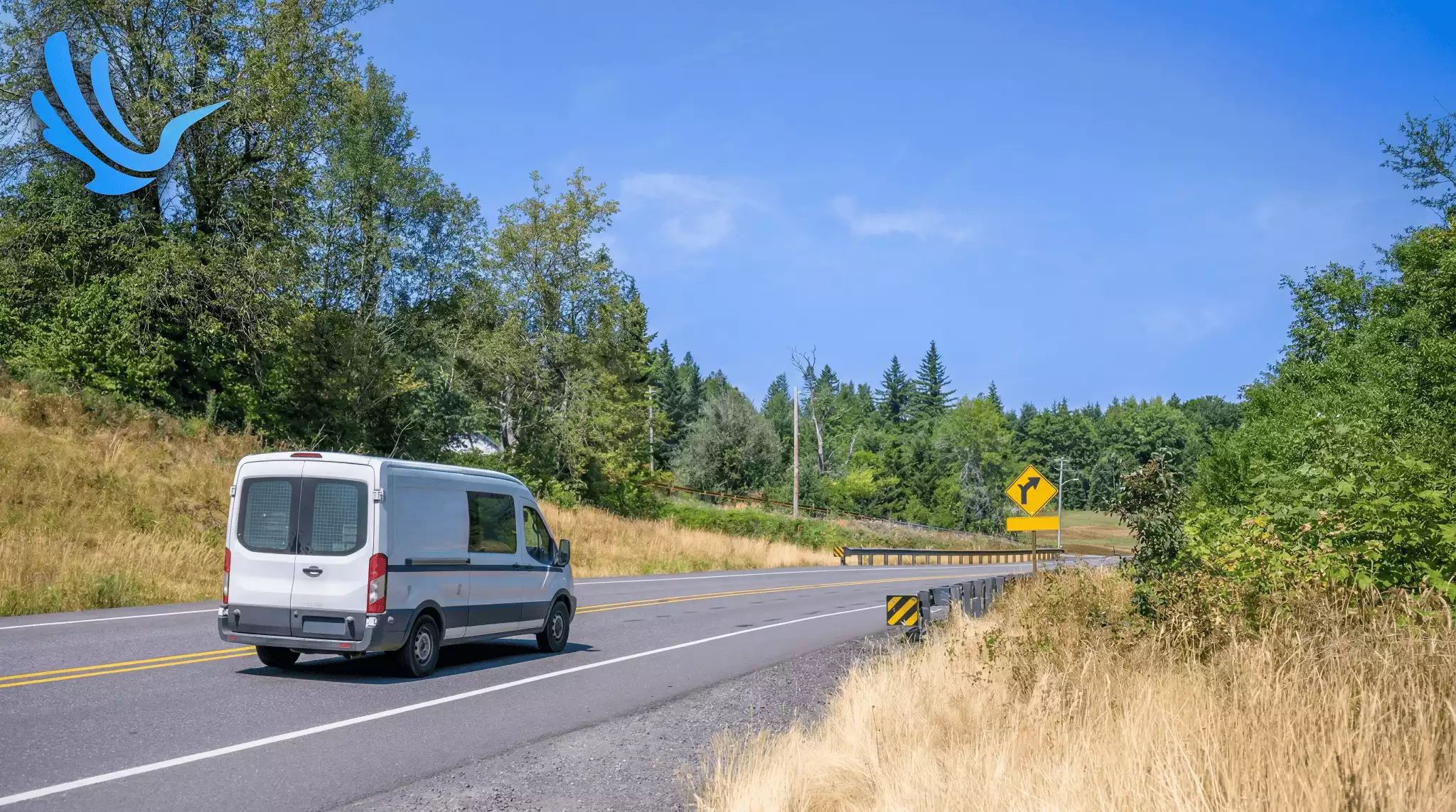 White delivery van driving on open rural highway route