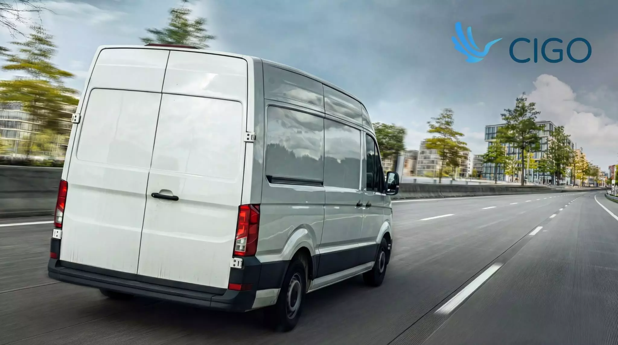 Delivery van driving through a city route, illustrating last-mile delivery tracking in progress