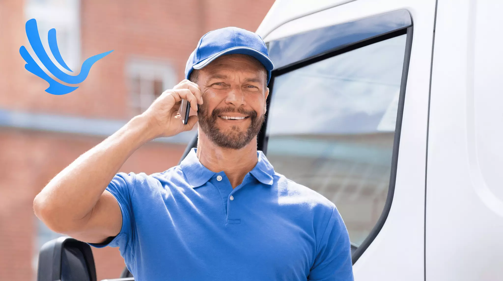Fleet delivery driver on phone call standing outside delivery van