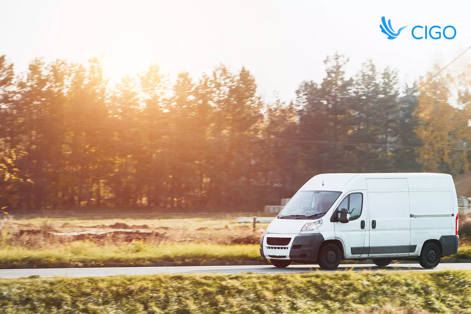 White delivery van on mixed job type route at sunrise