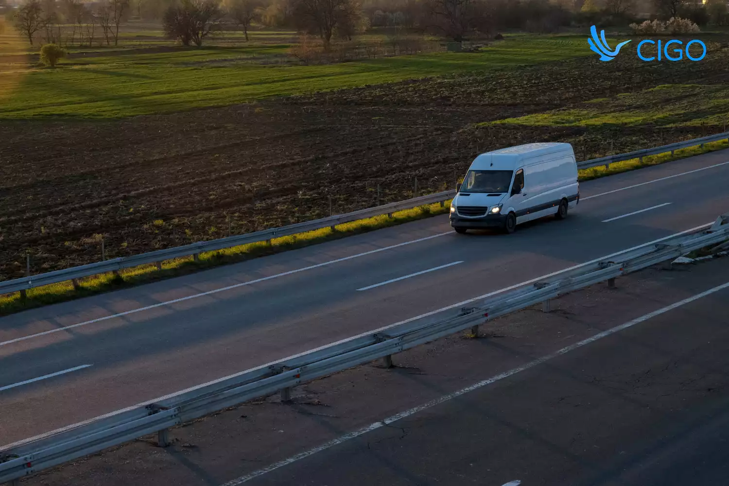 White delivery van on scheduled last-mile route at dusk