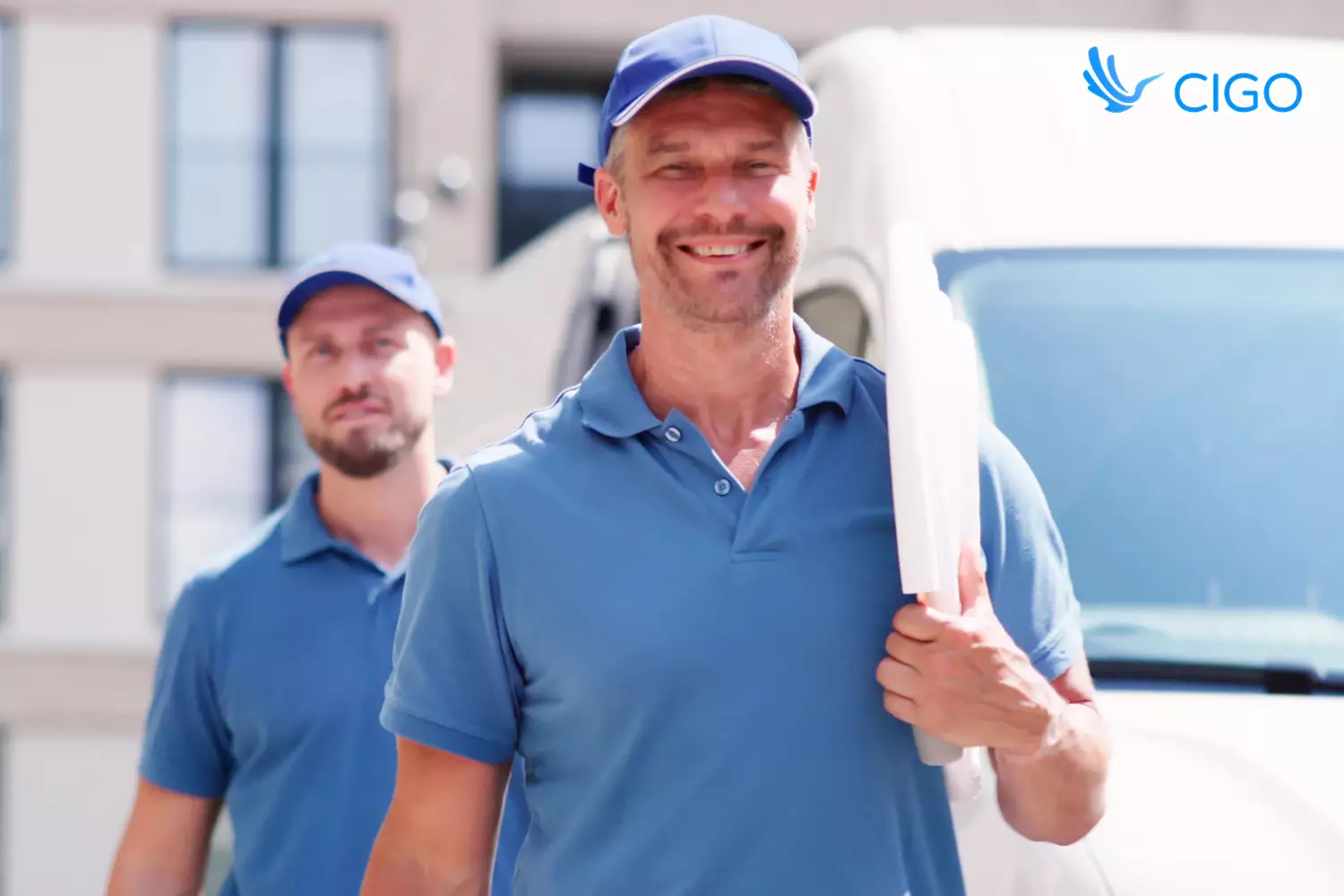 Two-person installation crew arriving at scheduled job site