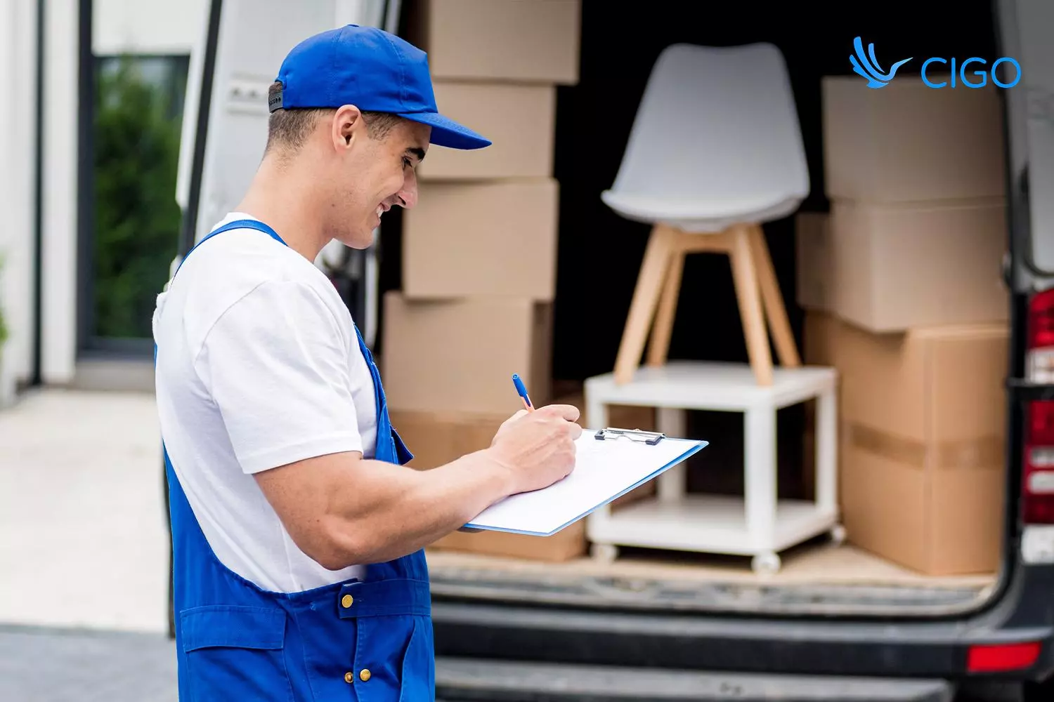 Driver confirming a loaded van of bulky goods, showing how delivery management software for large items validates every route