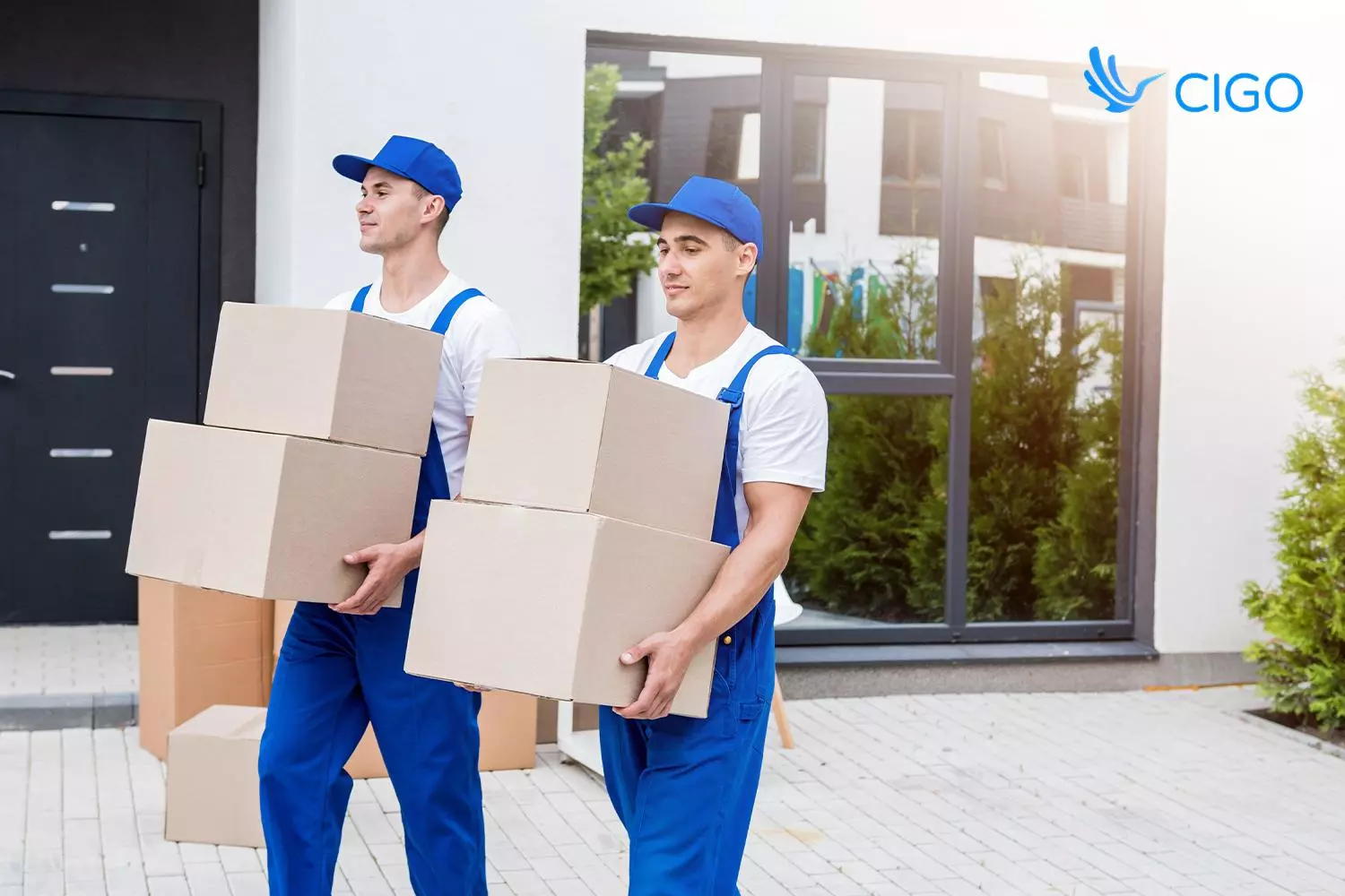 Two-person crew delivering bulky goods to a customer's home, the white-glove service courier delivery software coordinates