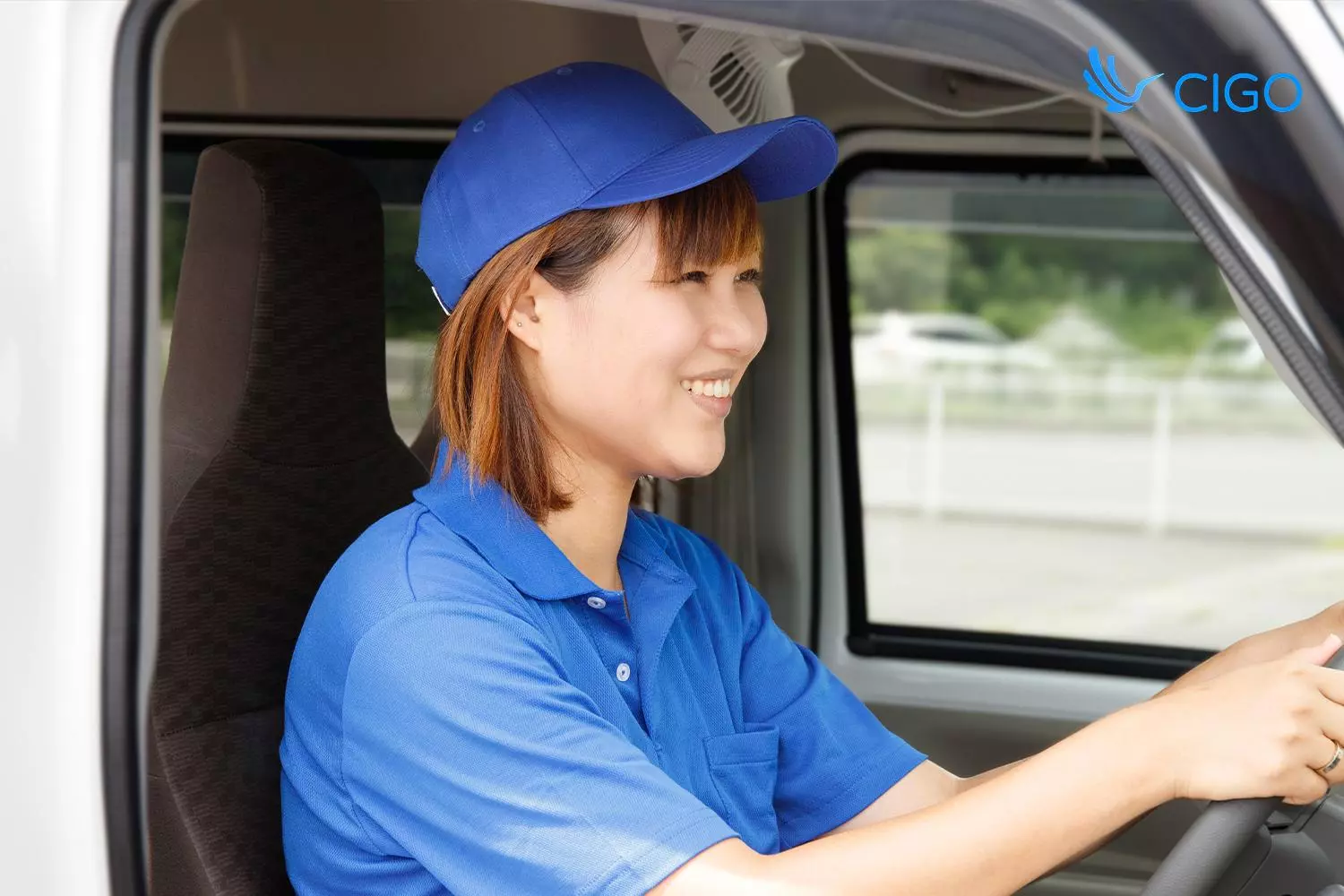 Fleet driver on route, representing truck delivery scheduling software that coordinates setup and haul-away jobs