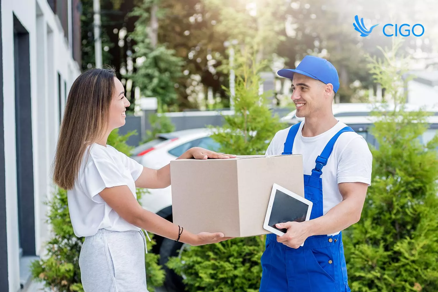 Uniformed crew completing an in-home white-glove delivery, a core part of mattress delivery logistics