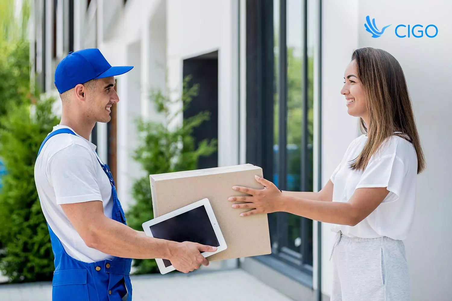Driver capturing proof of delivery on a tablet, part of last-mile delivery optimization for mattress fleets